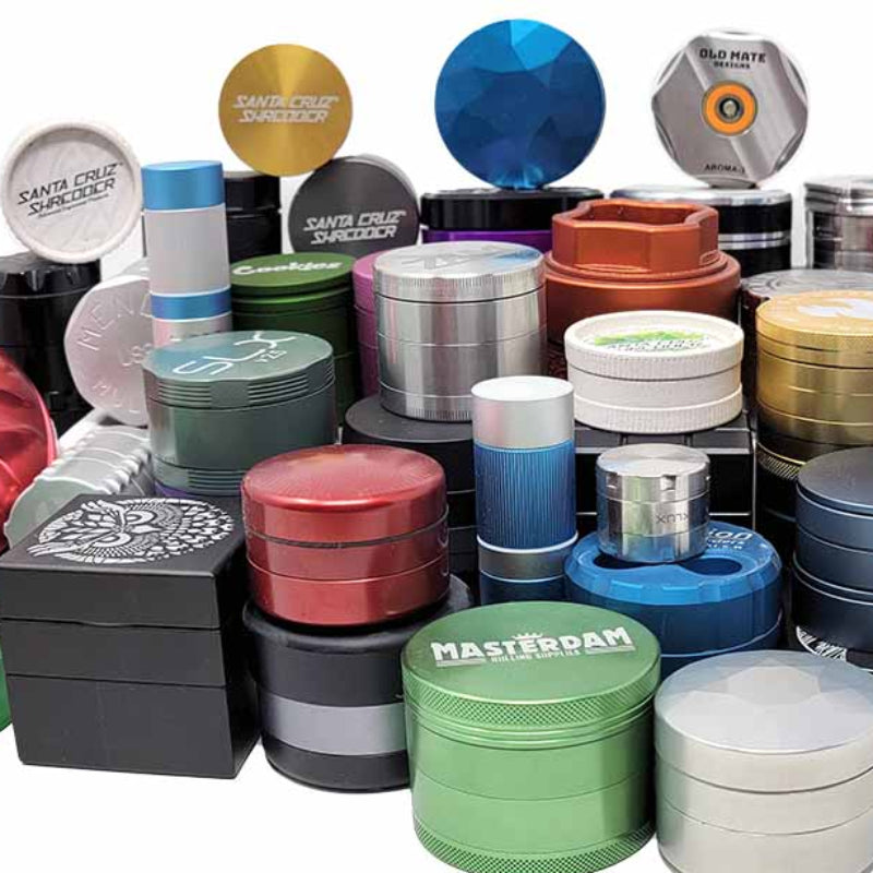 Assorted weed grinders on a white backround