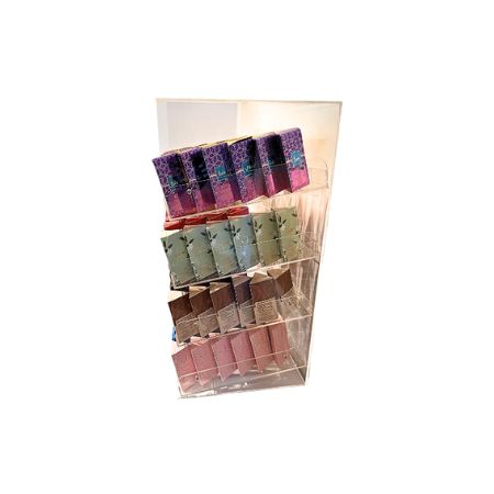 A clear acrylic vertical organizer rack holding multiple small rectangular roll on bottles in boxes on a white background.