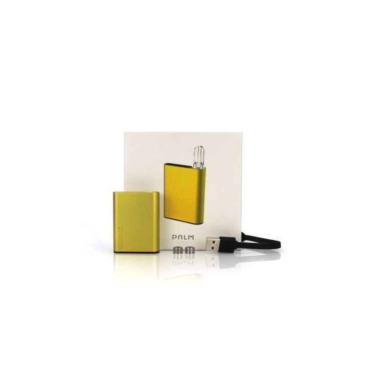 Yellow electronic device with packaging and USB cable on a white background