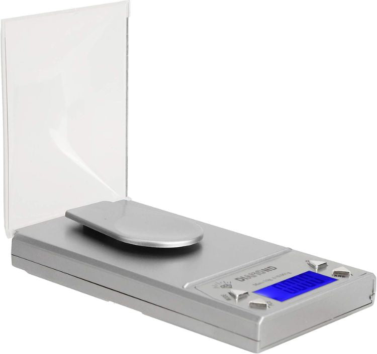 Digital kitchen scale with a clear lid on a white background