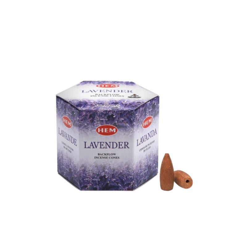 A box of HEM Lavender Bacchanal Incense Cones with two brown incense cones placed in front, set against a plain white background.