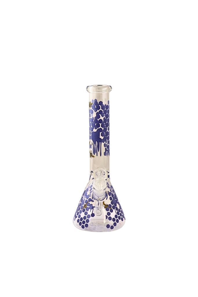 Glass beaker with blue and white pattern on a white background