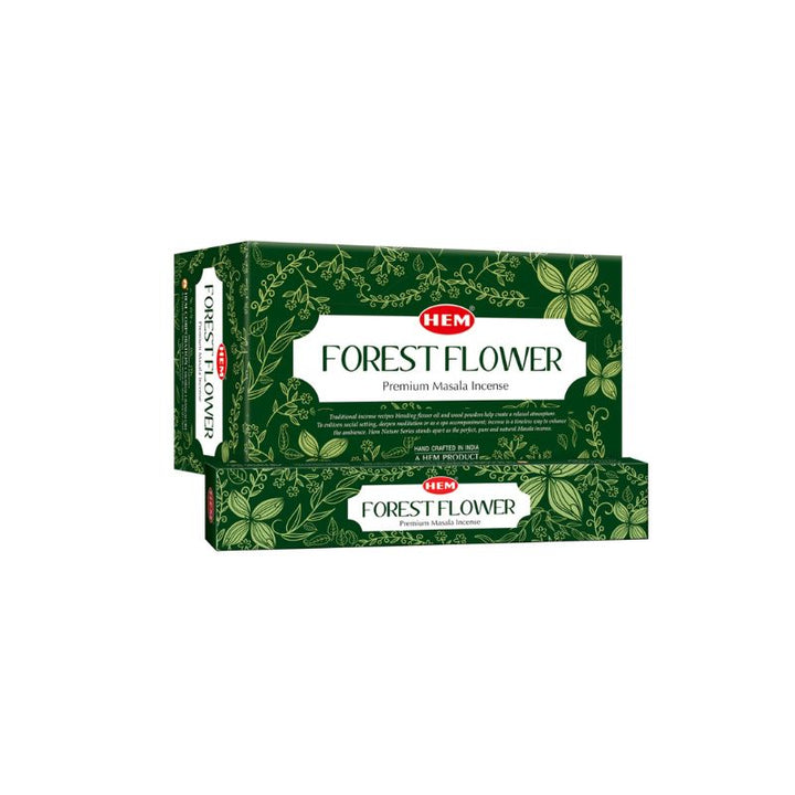 Two boxes of HEM Forest Flower Premium Masala Banta incense sticks, featuring a dark green botanical pattern with a white central label, set against a plain white background.