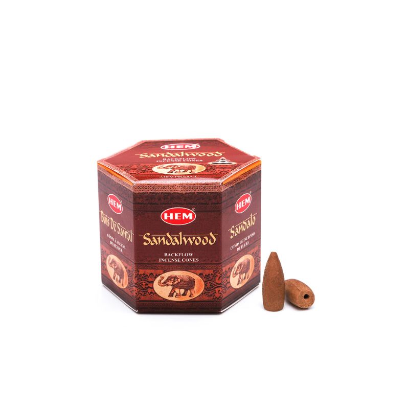 A box of HEM Sandalwood incense sticks with two brown cone incense sticks placed in front, set against a plain white background.