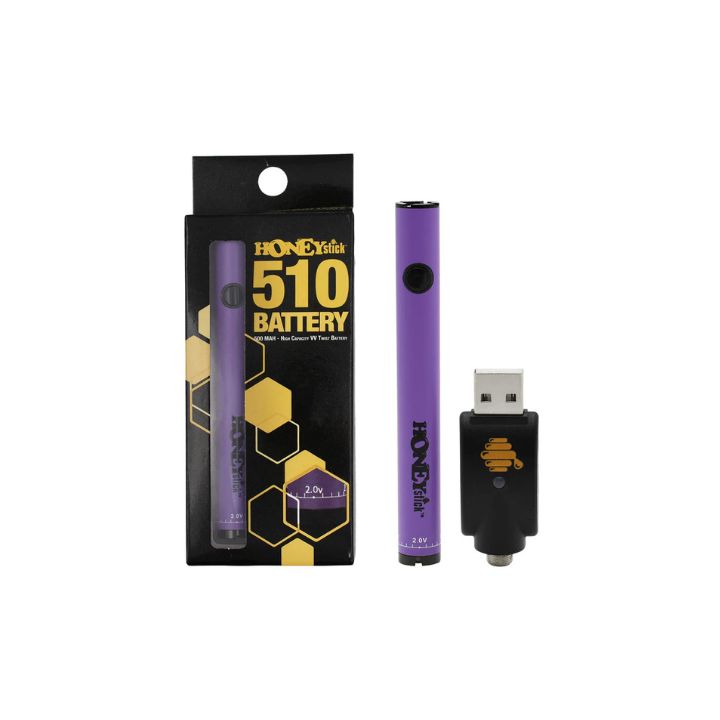 Purple vaping device with packaging and USB adapter on a white background