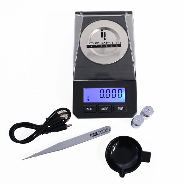 Digital scale with accessories on a white background