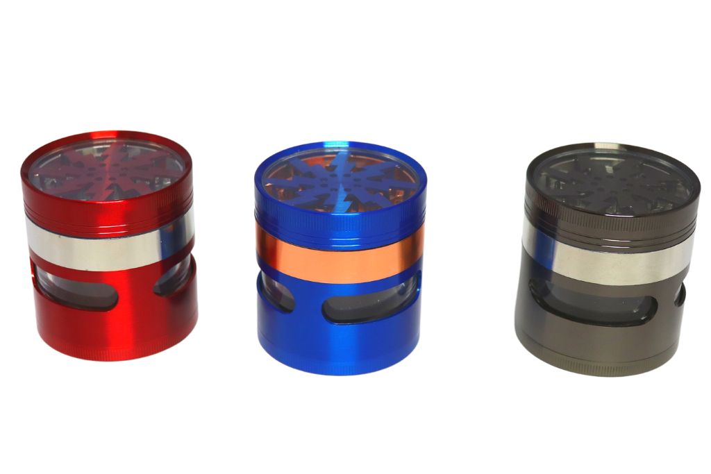 Three metal grinders in red, blue, and black on a white background