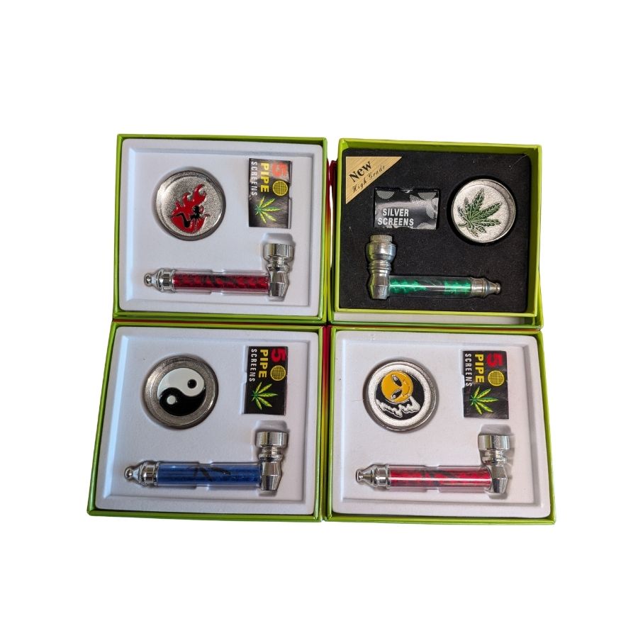Metal tobacco pipe, grinder and pipe screen on a white background