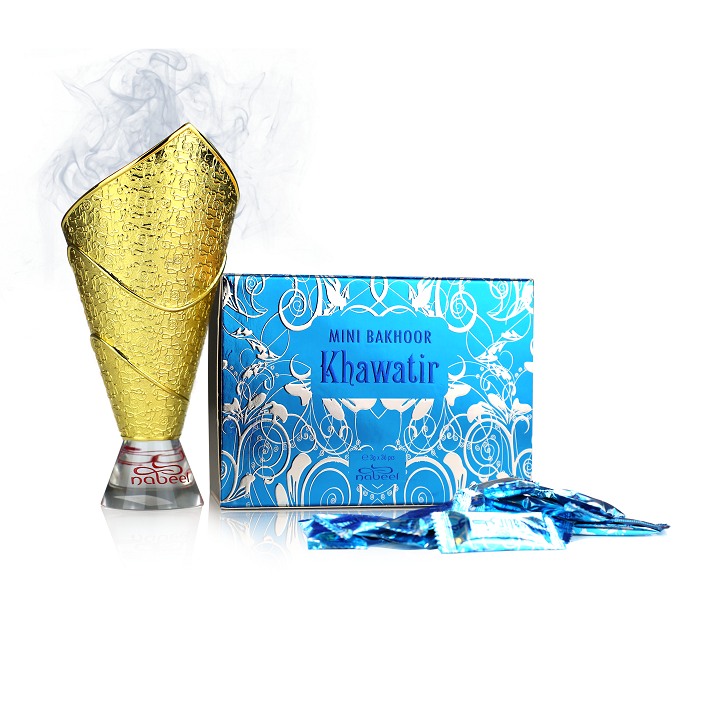 Gold bakhoor burner and blue mini bakhoor box labeled 'Khawatir' on a white background