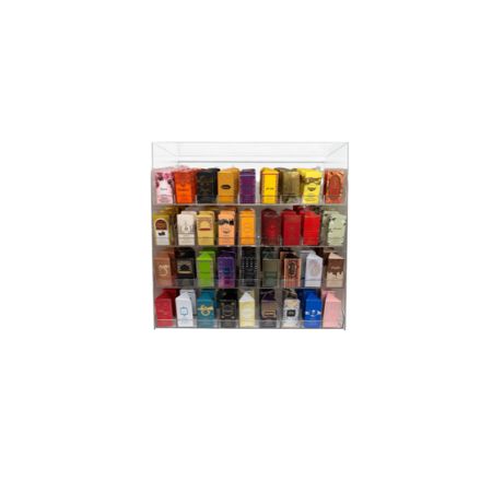 A clear acrylic wall-mounted organizer with multiple small rectangular compartments holding assorted 6ml roll on attar bottle boxes on a white background. 