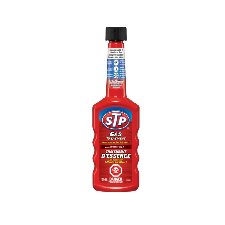 Red bottle of STP gas treatment on a white background