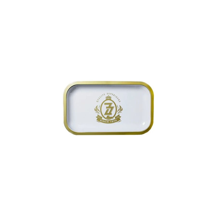 Small rectangular tin with gold rim and logo on a white background