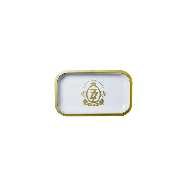 Small rectangular tin with gold rim and logo on a white background