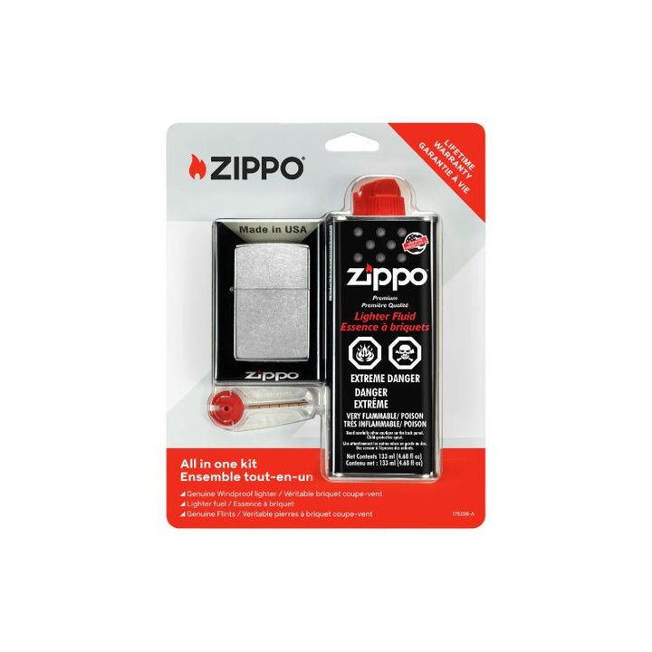 Zippo All-In-One Fire Starter Kit in its original blister packaging, featuring a silver lighter, a black lighter fluid can with a red cap, and a red key on a white and red cardboard backing on a white background