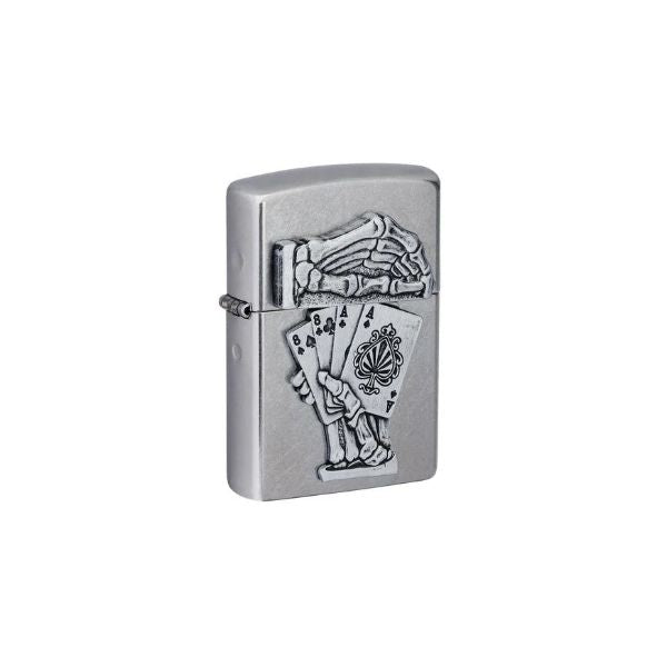 A silver metal Zippo lighter with a detailed relief design of a skeletal hand holding playing cards, shown on a plain white background.