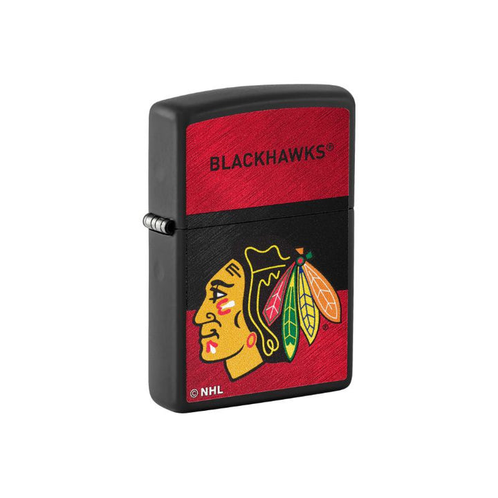 A black Zippo lighter featuring the Chicago Blackhawks NHL logo, with a textured red panel at the top displaying &