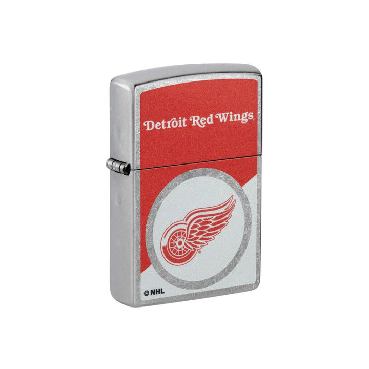 A silver metal lighter with a Detroit Red Wings NHL design, featuring a red and white graphic with the team logo and text on a white background