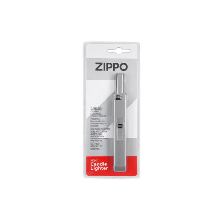 A Zippo Mini Candle Lighter in its original retail blister packaging, featuring a silver metal lighter and a white and red backing card.