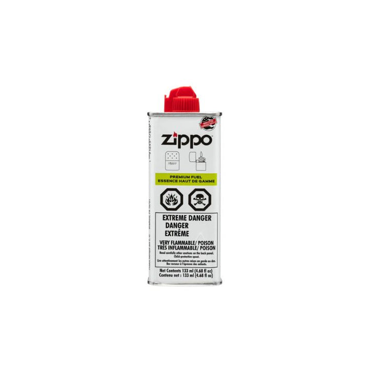 Zippo lighter fluid can with red cap on a white background