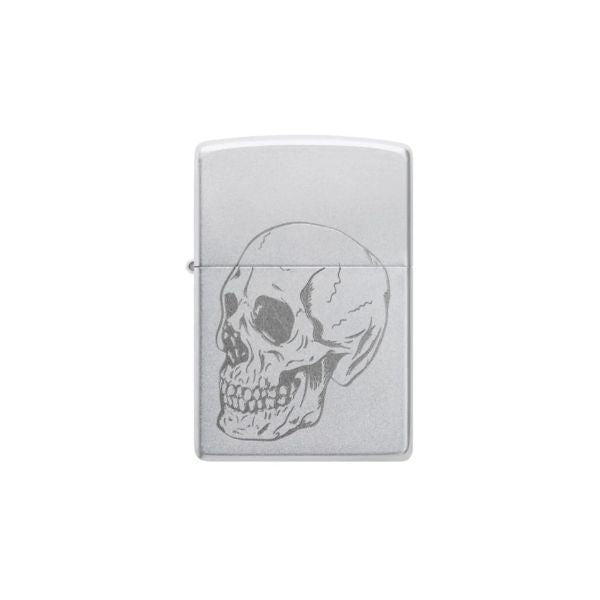 A silver metal Zippo lighter with an engraved skull design on the front, shown against a plain white background.