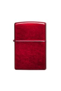 A classic zippo rectangular lighter with a textured red finish, shown against a plain white background.