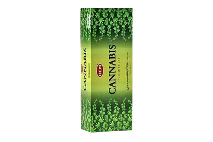 Pack of cannabis incense sticks with green design on a white background