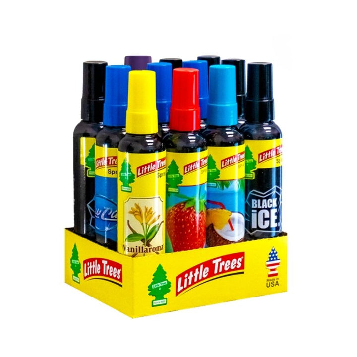 A retail display of Little Trees indoor air freshener spray bottles in a yellow cardboard tray, featuring various scents including Vanilla, Strawberry, Coconut, and Black Ice on a white background.