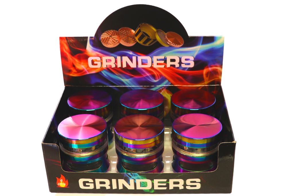Display box of colorful grinders with &