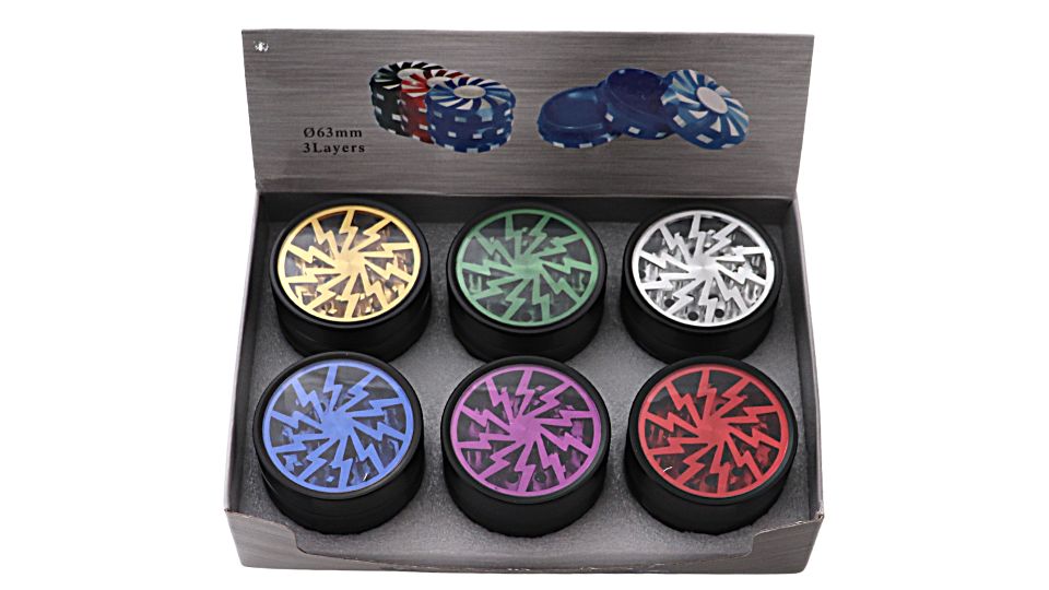 Set of colorful grinder tops in a box with poker chip design in the background