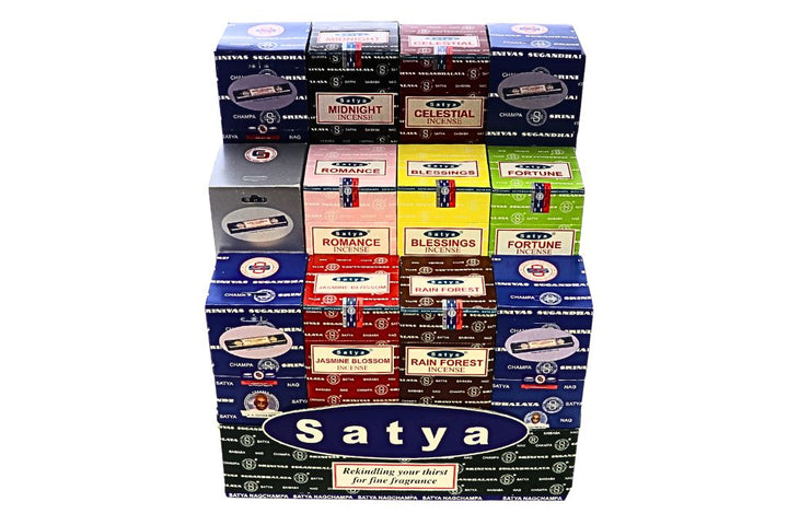 Stack of Satya incense boxes in various colors on a white background