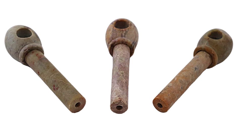 Stone tobacco pipes large on a white background