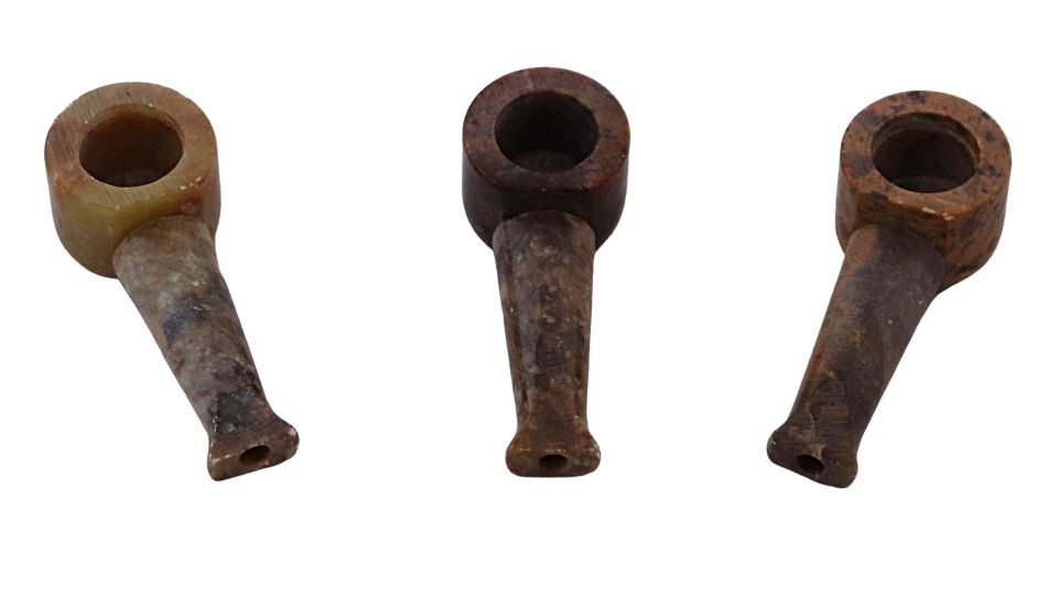 Stone tobacco pipes mini on a white background