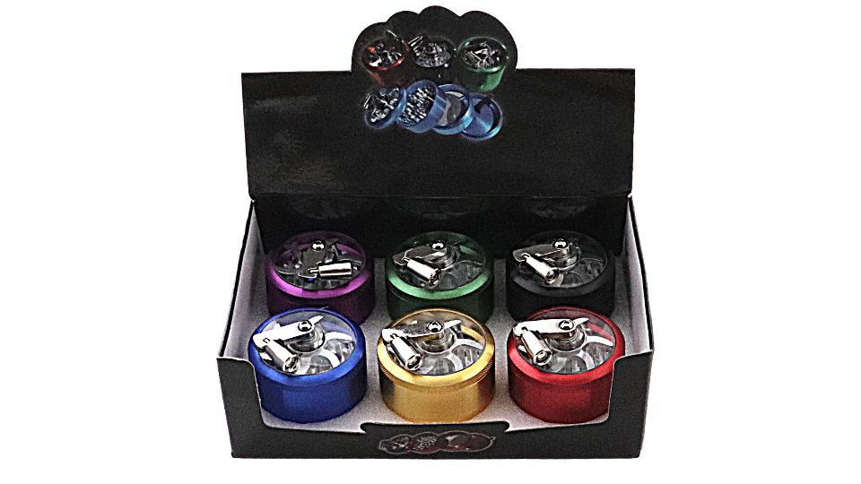Set of colorful metal grinder tops in a black display box on a white background