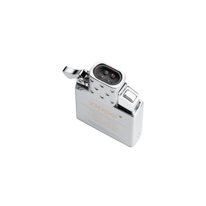 A Zippo lighter arc insert with a polished chrome finish, featuring a hinged lid and a visible flame wheel mechanism, set against a plain white background.