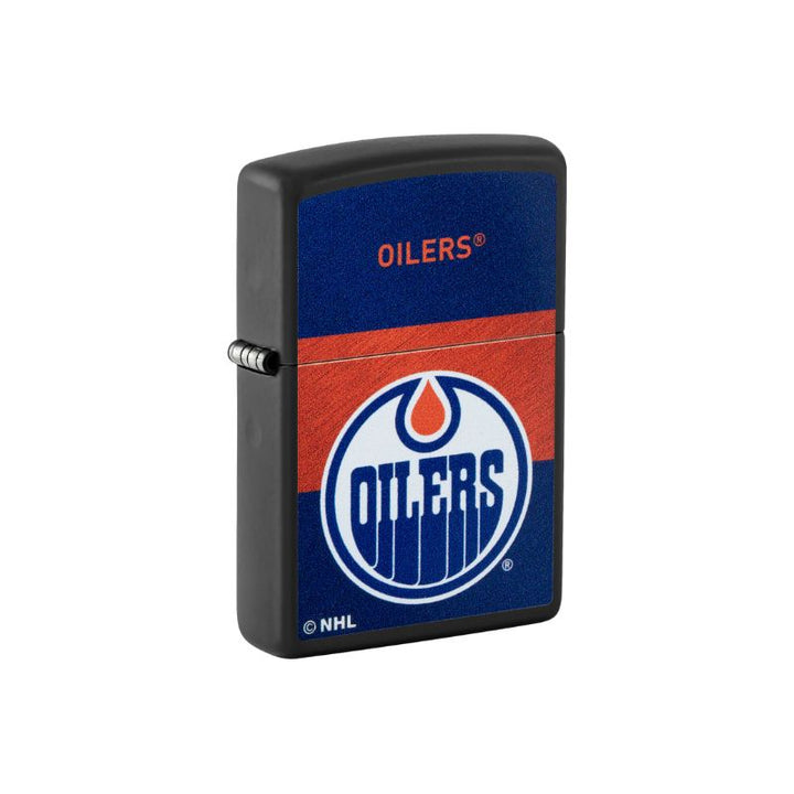 A black Zippo lighter featuring the Edmonton Oilers NHL logo on the front, with a blue and red textured design and the word &